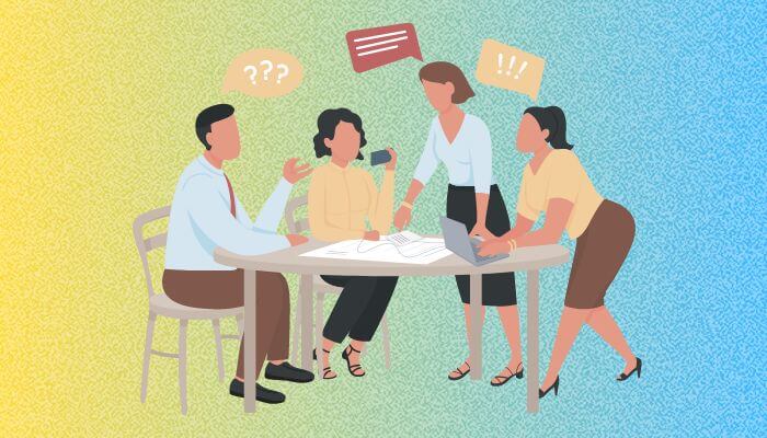 Grupo de pessoas discutindo estratégias em torno de uma mesa, com balões de diálogo acima de suas cabeças, indicando colaboração para apagar comentários no Instagram.